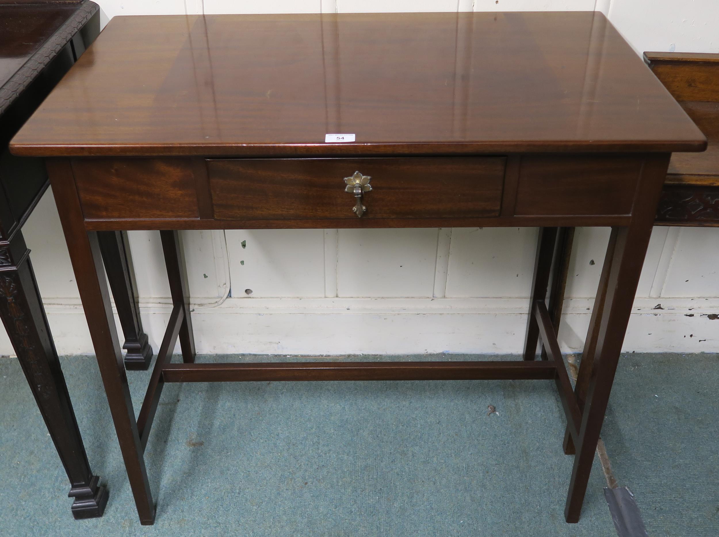 A 20th century mahogany single drawer hall table on stretched supports, 86cm high x 92cm wide x 51cm