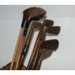 Two vintage woods, brass-headed putter and four hickory-shafted clubs Condition Report:Available