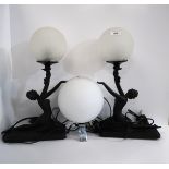 A pair of Art Deco style lady lamps with ball shades and a further lamp Condition Report:Available