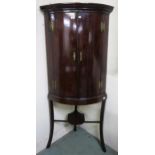 A Victorian stained oak dome front two door corner cabinet on stand, 179cm high x 80cm wide x 55cm