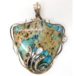 An American designer silver pendant set with a specimen turquoise further set with mother of pearl