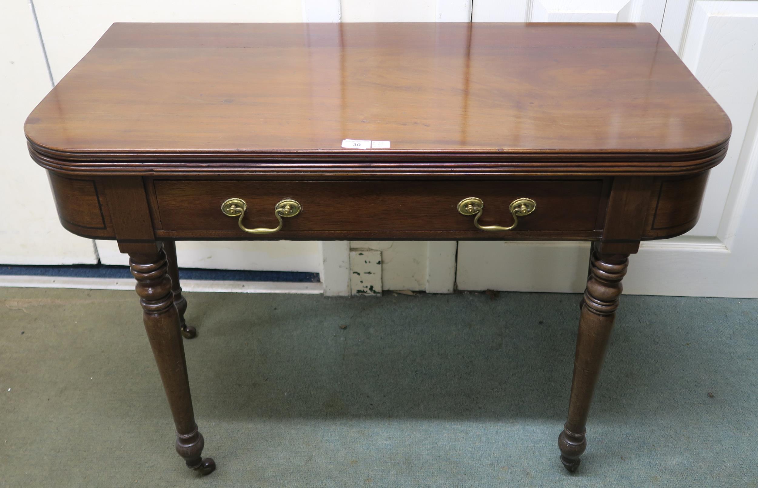 A Victorian mahogany single drawer foldover tea table, 73cm high x 102cm wide x 51cm deep