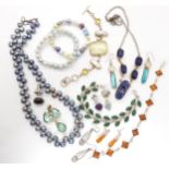 A collection of silver and white metal gem set jewellery to include an amber bracelet, amethyst