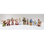 A collection of Alice in Wonderland Bronte Porcelain extinguishers to include The Duchess, Alice,