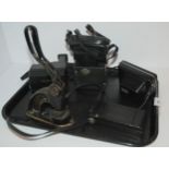 A tray lot of various cameras and desk embosser Condition Report:Available upon request