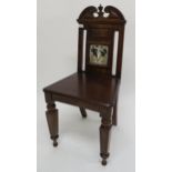 A Victorian mahogany side chair inset with decorative tile titled spring Condition Report: