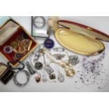 A leather writing case full of vintage costume jewellery Condition Report:Condition report: Not