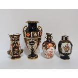 Two Royal Crown Derby twin handled vases, smaller is date cipher for 1908, larger 1926, a spill vase