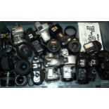 A collection of various camera bodies and various lenses Condition Report:Available upon request