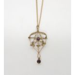 A 9ct gold Edwardian pendant brooch, set with pearls and amethyst, with a yellow metal chain