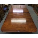 A Victorian mahogany extending dining table on turned supports, 72cm high x 253cm long x 119cm deep