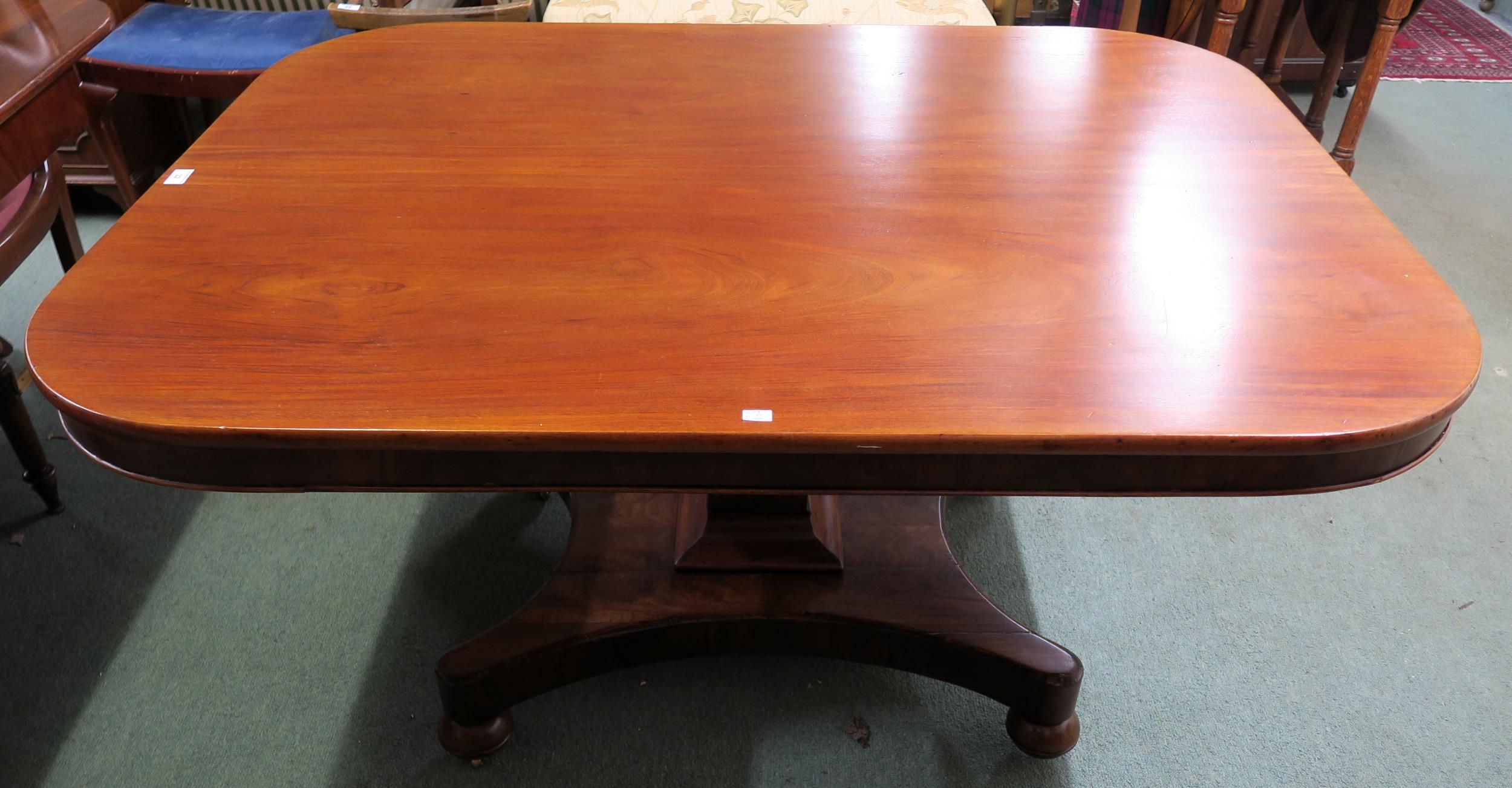 A Victorian mahogany tilt top breakfast table on quadrupedal base, 73cm high x 137cm wide x 106cm