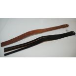 A brown leather Lochgelly tawse by John. J. Dick and a black tawse by P. McRostie & Co (2) Condition