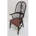 A 20th century stained pine "Ben chairs" Windsor style armchair Condition Report:Available upon
