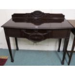 A 20th century mahogany buffet table with three carved frieze drawers on square tapering supports,