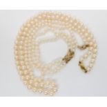 Two strings of pearls and a matching bracelet all with 9ct gold box clasps Condition Report: