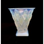 A Sabino opalescent glass vase, of conical shape, the body moulded with fish heads, moulded and