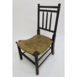 A 19th century stained Bobbin turned child's chair with strung seat Condition Report:Available