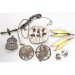 Two silver David Andersen yellow enamel leaf brooches, a ceramic Danish brooch depicting deer, a