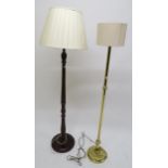 A 20th century brass standard lamp and another mahogany standard lamp (2) Condition Report:Available