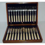 A cased twelve-piece fish knives and forks Condition Report:Available upon request