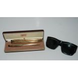 A Cross cased pen set and a pair sunglasses stamped Ray Ban Condition Report:Available upon request