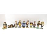 A large selection of Beswick Alice in Wonderland 1974 figures including The Cheshire Cat, Mock