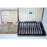 A cased set of eleven silver-handled butter knives and a cased set of six silver-handled butter