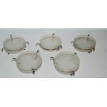 Five silver-rimmed butter dishes, Birmingham 1944, 9cm diameter Condition Report:Available upon