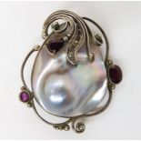 An American designer pendant set with a mabe pearl and garnets, (signed see photo) Condition