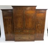 A 19TH CENTURY MAHOGANY CROSSBANDED COMPACTUM the dentil cornice above a central pair of doors,