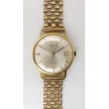 A 18CT GOLD MARVIN WATCH HEAD with cream dial gold and black baton numerals and hands with date