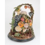 A VICTORIAN WAX DISPLAY OF FRUIT on circular base with domed glass case, (af), 50cm high Condition