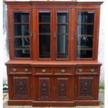 A LATE VICTORIAN MAHOGANY BREAKFRONT DISPLAY CABINET with four glazed doors enclosing shelves with