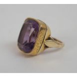 A 15ct GOLD AND AMETHYST GENTS RING converted from watch fob, the side of the ring inscribed 1894-