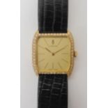 AN 18K GOLD LADIES DIAMOND SET CORUM WRISTWATCH with gold coloured Corum logo dial, and gold