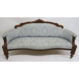 A VICTORIAN MAHOGANY FRAMED SOFA, upholstered in a light blue damask fabric on turned supports,