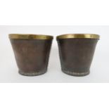 A PAIR OF VICTORIAN LEATHER AND BRASS BOUND BUCKETS with stud work, 23cm high x 26cm wide