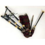A SET OF BAGPIPES in box (af) with Argyll and Sutherland badge Condition Report: