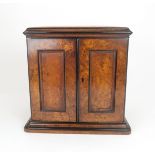 A VICTORIAN BURR WALNUT THREE DRAWER COLLECTORS/TABLE CABINET with hinged doors and brass inset