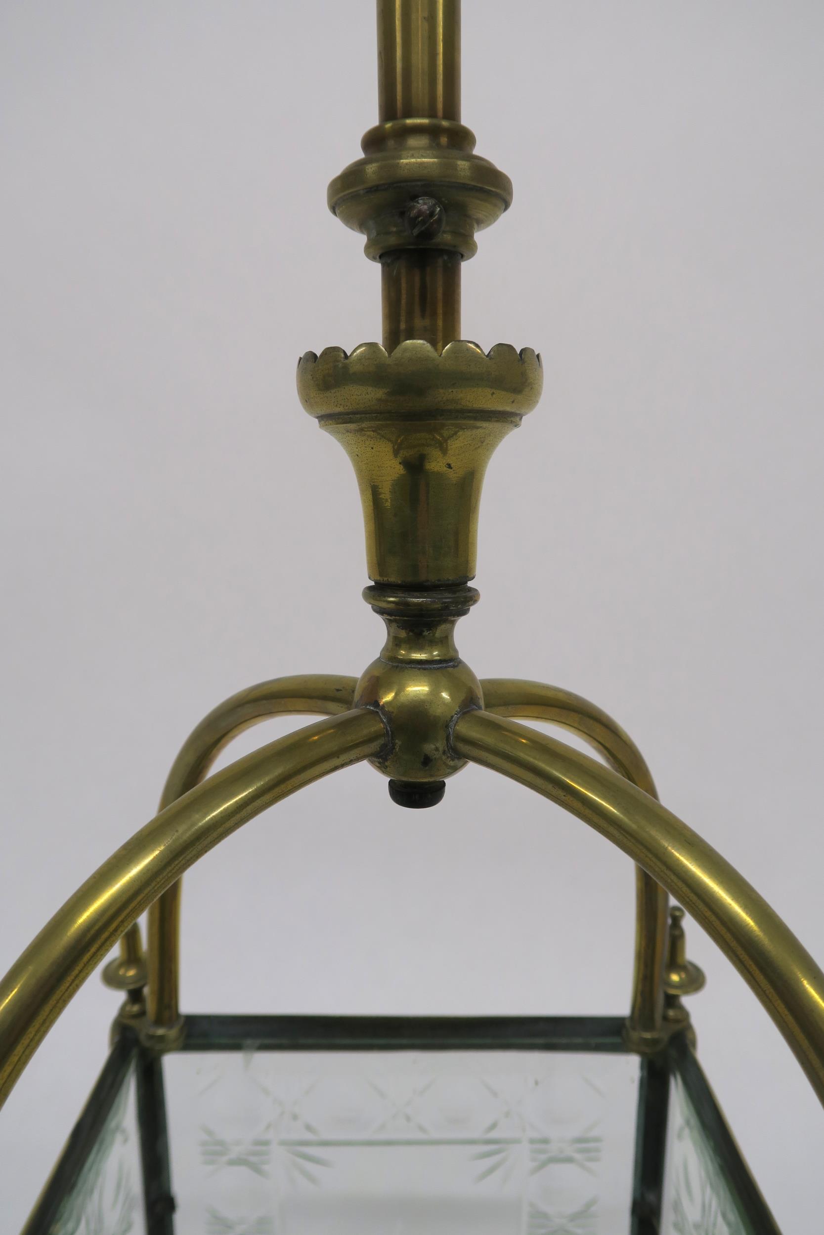 AN EDWARDIAN BRASS AND CUT GLASS HALL LANTERN set with four foliate cut panels and base, 90cm - Image 5 of 6