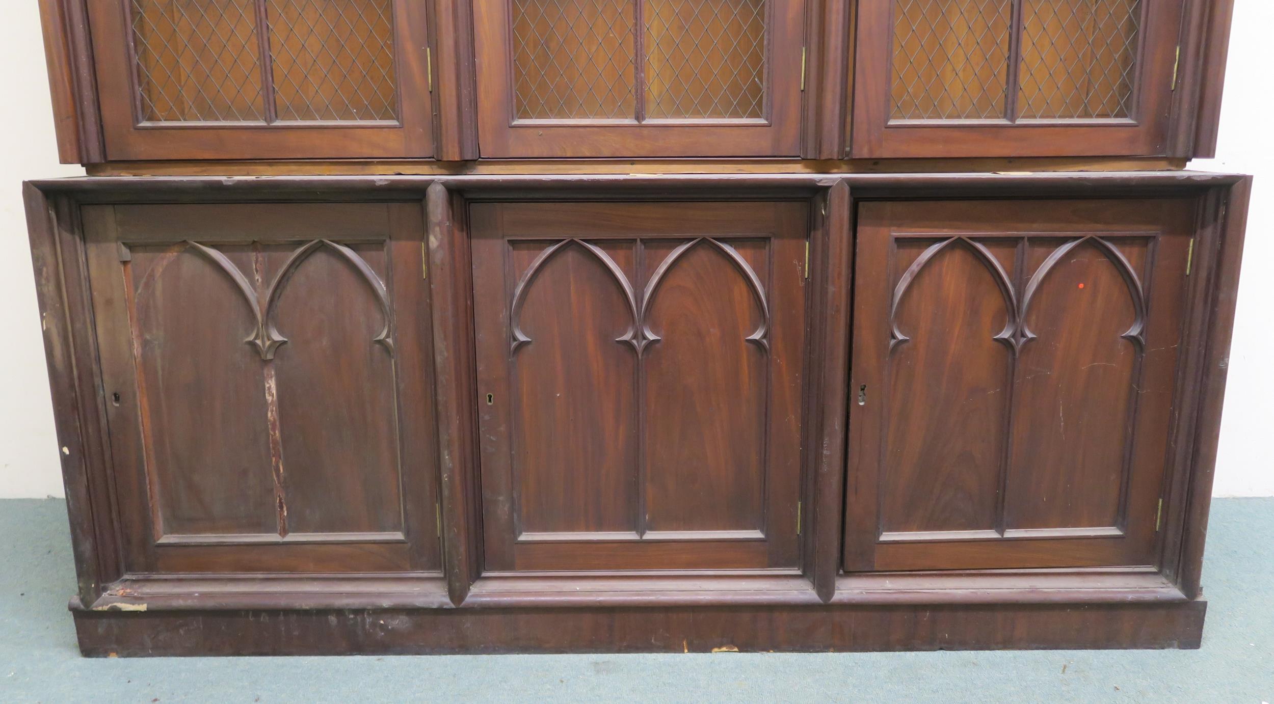 A VICTORIAN MAHOGANY GOTHIC REVIVAL BOOKCASE, with three pierced grill doors above three stylized - Image 2 of 10