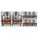 A SET OF EIGHT MAHOGANY DINING CHAIRS, comprising two carvers and six regular chairs each with