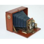 A J. LIZARS 'CHALLENGE' QUARTER PLATE TROPICAL HAND & STAND CAMERA with J Lizars circular plaque,