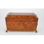 A 19TH CENTURY BURR WALNUT TWO-DIVISION TEA CADDY with fitted interior and mixing bowl, with lion