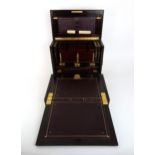 A VICTORIAN INLAID ROSEWOOD STATIONARY BOX the exterior inlaid with an urn and scrolling foliage the