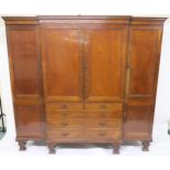 A VICTORIAN MAHOGANY BREAKFRONT COMPACTUM,  with central two door linen press