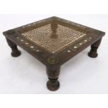 AN ANGLO INDIAN TEAK LOW STOOL with wicker seat and foliate bone inlaid borders, divided by metal