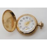 A LADIES 14K WALTHAM FOB WATCH with a white enamelled dial with French gold transfer details,