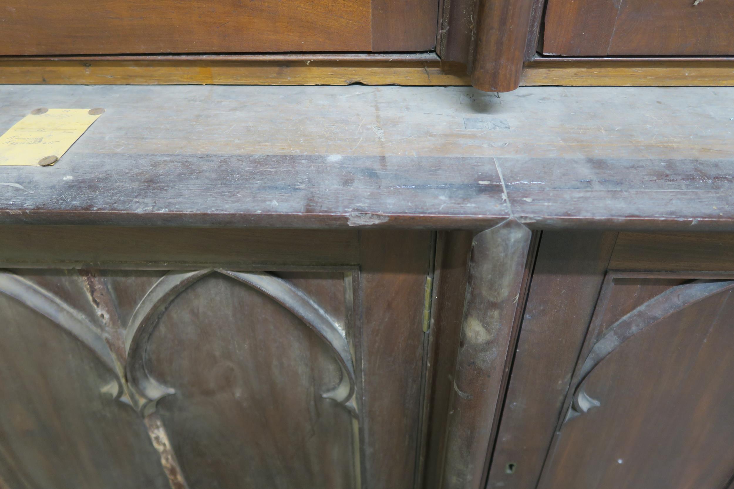 A VICTORIAN MAHOGANY GOTHIC REVIVAL BOOKCASE, with three pierced grill doors above three stylized - Image 7 of 10